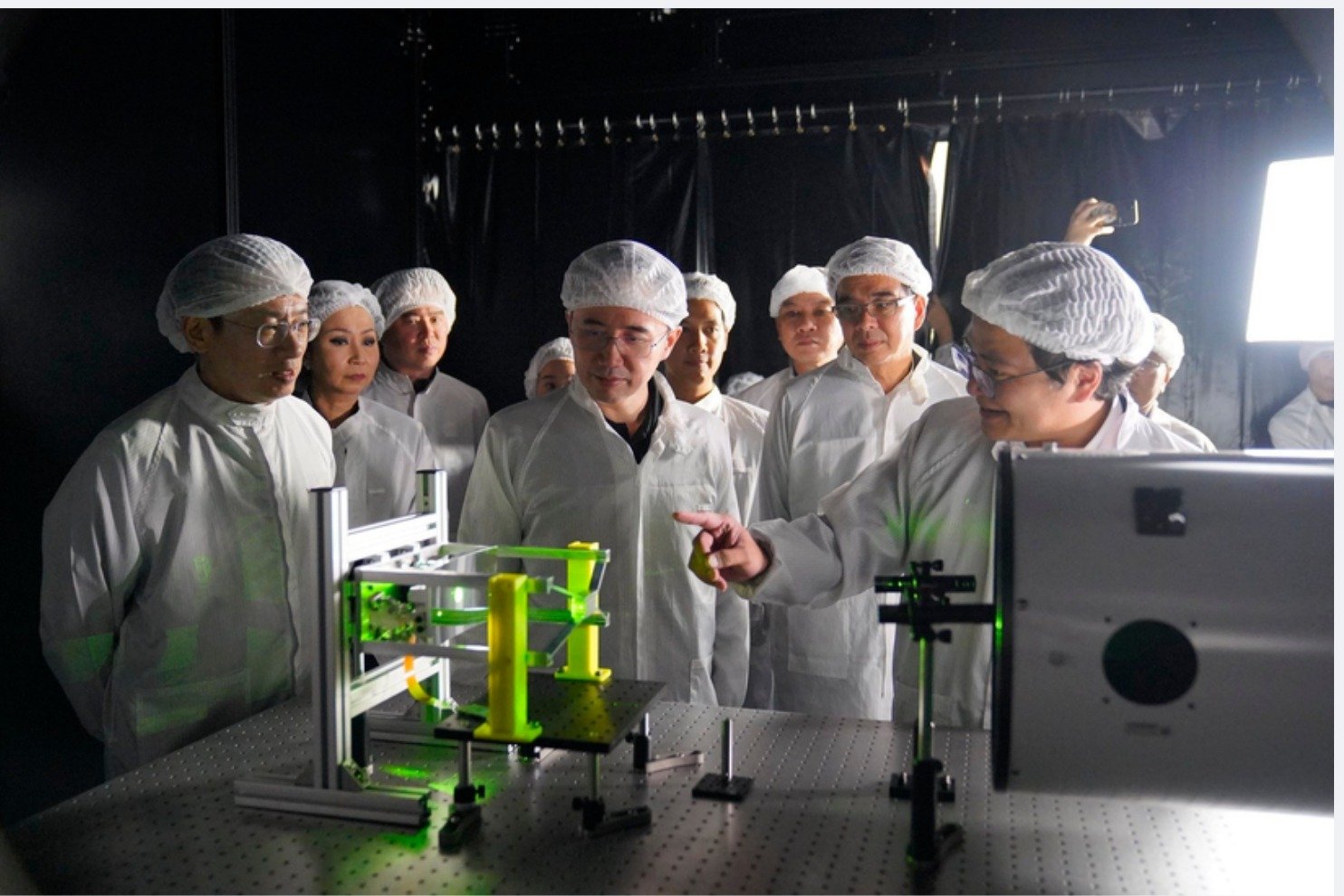 MHESI leadership viewing the 6U CubeSat telescope optics under alignment at SEAL Lab